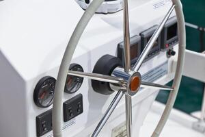 Sailing yacht control wheel and implement. photo