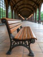 Ornate wooden bench in a grand indoor hallway photo