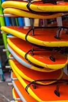 Surf boards in a stack photo