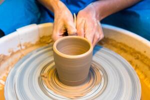 Pottering - creating a clay cup in process photo