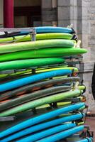 Surf boards in a stack photo
