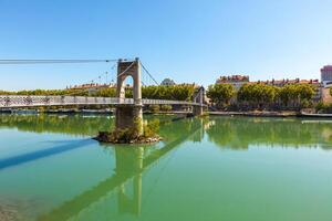 Old Passerelle du College bridge over Rhone river in Lyon, France photo