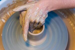 Pottering - creating a clay cup in process photo