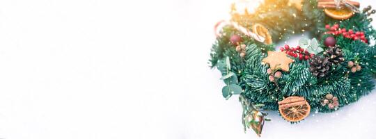 Christmas wreath isolated on a white snow background photo