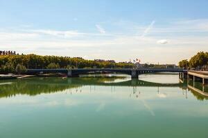 Cityscape of Lyon, France with reflections in the water photo