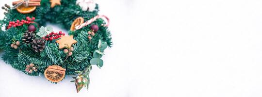 Christmas wreath isolated on a white snow background photo