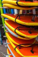 Surf boards in a stack photo
