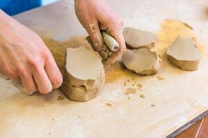 Pottering - creating a clay cup in process photo