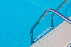Ladder of a swimming pool photo