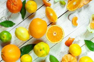 Citrus fresh fruit on the white wooden table photo