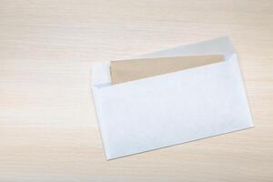 Photo of blank envelope on a wooden background