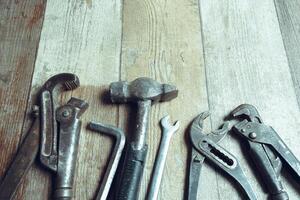 Working tools on wooden rustic background. top view photo