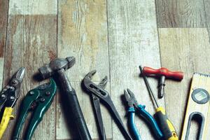 Working tools on wooden rustic background. top view photo