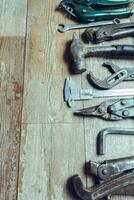 Working tools on wooden rustic background. top view photo