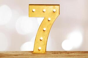 Big plastic numbers with shining light bulbs photo