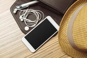 Office table with smartphone on it. View from above photo