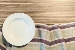White Plate on a Tablecloth photo