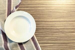 White Plate on a Tablecloth photo