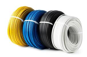 Four Spools of Electrical Wire in Yellow, Blue, Black, and White Colors. A Close-Up Photo of Four Spools of Electrical Wire, Each Wound in a Different Color.