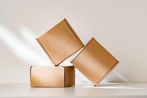 Freshly packed cardboard boxes resting on a white surface, illuminated by soft natural light photo
