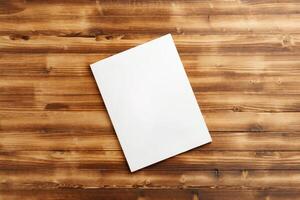 A Blank Notepad Resting on a Wooden Table in Natural Light During Daytime photo