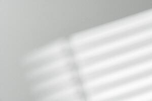 Gray background with shadows and light from window photo