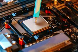 Applying thermal paste to a computer processor photo