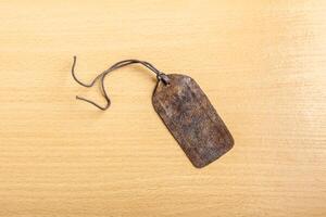 Blank tag on wooden background photo