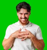 A man with a beard smiles confidently against a bright green background photo