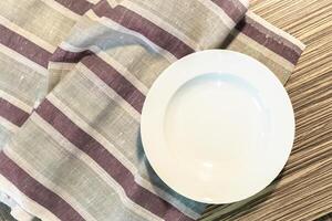 White Plate on a Tablecloth photo