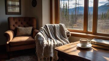 A chair and a coffee cup sit in front of a window photo
