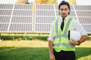 Solar panels. Engineer man on solar power station photo