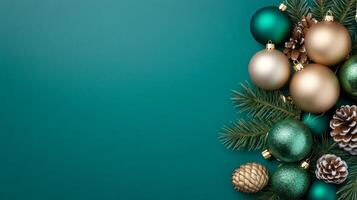 Elegant holiday decorations with gold and emerald green ornaments against a dark teal background photo