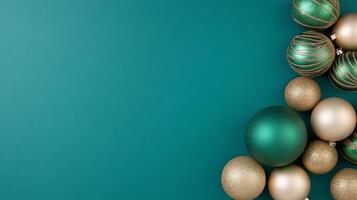 Luxurious holiday decorations featuring emerald green and metallic gold ornaments on a dark teal background photo
