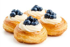Delicious Danish pastry topped with blueberries and cream cheese on a white background highlighting its fresh texture photo