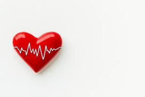 Minimalist red ECG line creating a heart shape symbolizes heart health and medical care on a clean white backdrop photo