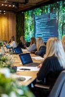 Team of women collaborating on coding strategies at a conference table in a modern office setting photo