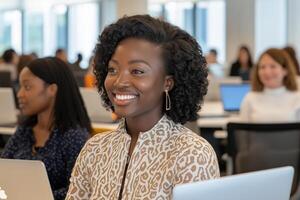 Diverse group of women collaborating on a coding project in a bright office during a productive work session photo
