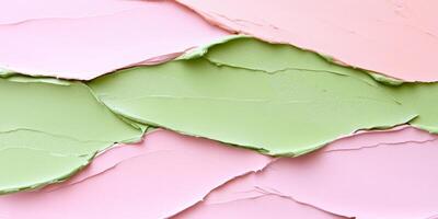 Textured paper in soft shades of green and pink with natural lighting creating an elegant background photo