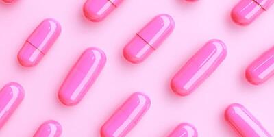 Assorted pastel capsules arranged in a pattern against a soft pink background for an abstract medical theme photo