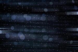 Abstract background of blurred motion drop light on the dark background. Spark a horizontal line of light. photo
