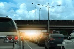 Luxury of car stop on the road junction by traffic light control in across. Traveling in the provinces during the bright period. Open light brake. Concrete bridge crossing level intersection. photo