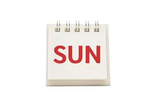SUN text on desk calendar with clipping path isolated on white background. SUNDAY and Calendar concept photo