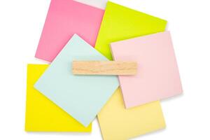 Blank Wooden block for text on colorful sticky note isolated on white background. Copy spa photo