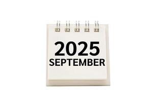 2025 SEP text on desk calendar with clipping path isolated on white background. 2025 SEPTEMBER and Calendar concept photo