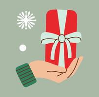 Hand holding a red gift box with a mint ribbon in flat style. Minimalistic design with festive elements like snowflakes, perfect for Christmas or holiday-themed projects and illustrations. vector