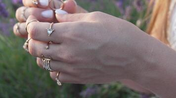 Hand with Many Rings in Lavender Field video