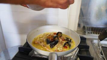 Chef Adds Ghee Butter to a Second Course of Scampi and Mussels in a Restaurant video