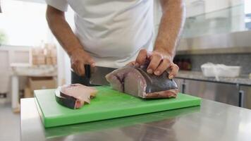Chef Cuts Swordfish On A Chopping Board To Make As A Second Course video