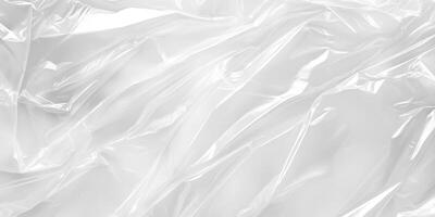 This closeup photo of a crumpled transparent plastic highlights its texture and sheen, making it ideal for backgrounds, packaging, and designs. The light and shadows enhance its visual appeal